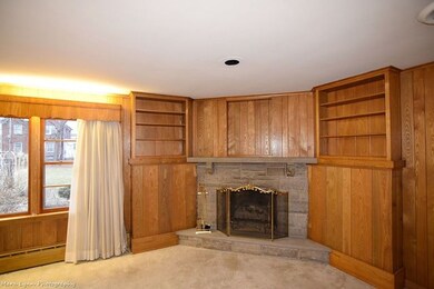 Beautiful fireplace with built ins on either side.