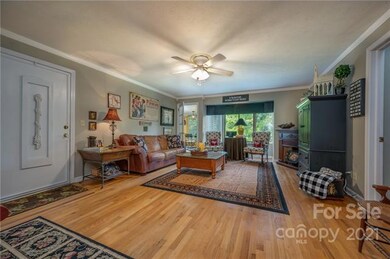 Living room with sunroom entrance on the left