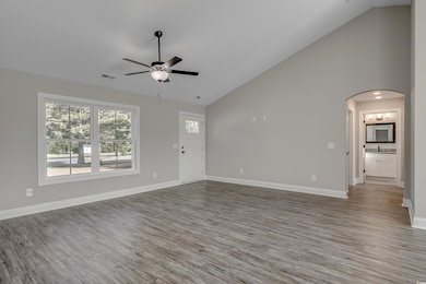 Unfurnished living room with wood-type flooring, h