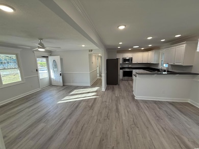 Kitchen featuring a sink, light wood-style floorin