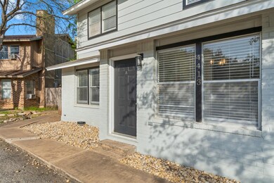 Property entrance featuring brick siding