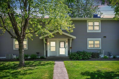 View of front of house with central AC unit and a 