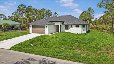 View of front facade featuring concrete driveway,
