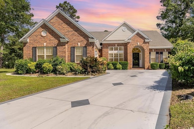 View of front of property featuring brick siding, a lawn, and a shingled roof