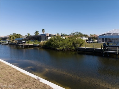 Dock area with a water view and a residential view