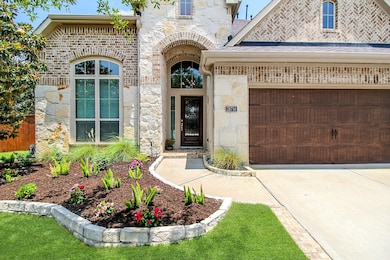 Upgraded Exterior elevation of brick and stone. Wo