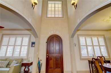 Two story foyer with custom painting accents