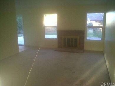 Living Room with Brick Fireplace