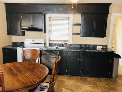 Kitchen also offers a eat at bar and opens to the living room. 