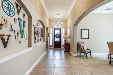 Tall ceilings in the foyer. New lighting, and niches for your custom art and collectibles