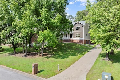 View of front of home with a porch and roof with s