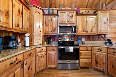 Kitchen with appliances with stainless steel finis