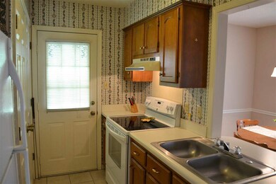 The kitchen has ample cabinet storage and work spa