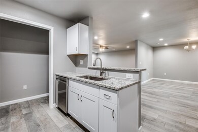 Kitchen with ceiling fan with notable chandelier, 