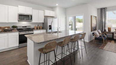 Kitchen featuring stainless steel appliances, a sink, dark wood finished floors, white cabinetry, and recessed lighting