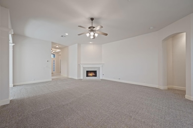 Unfurnished living room featuring a fireplace wit