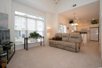 Living room featuring an inviting chandelier and l