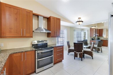 Kitchen with 42” soft close wood cabinets and tile