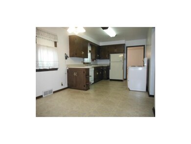 Spacious, eat-in kitchen with newer flooring & neu