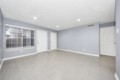 Spacious and well lit  living area.