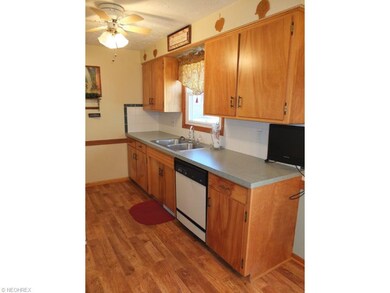 Kitchen with laminate flooring.