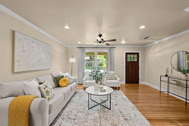 Living room featuring wood finished floors, reces