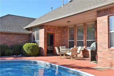 Covered patio to relax by pool or grill