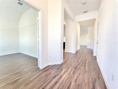 Hallway featuring light wood finished floors and 