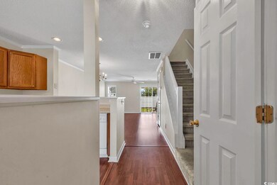 Interior space featuring ornamental molding, a tex