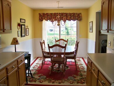 View of dinette with wainscoting & chair rail, bra