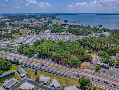 Aerial, outlined subject property with view of Lake Doras.