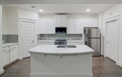 Kitchen with stainless steel appliances, visible 