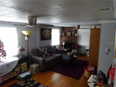 living room with real hardwood flooring and wood b