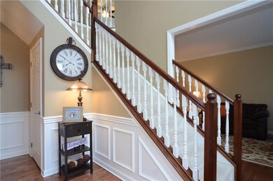 The entry is accented with custom wainscoting.