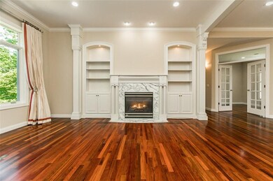 Great room cabinetry detail and French doors leadi