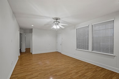 Spare room featuring light wood-style flooring, recessed lighting, and a ceiling fan
