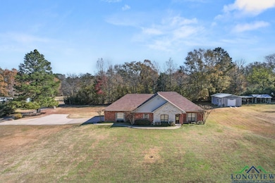 Ranch-style home featuring a front yard