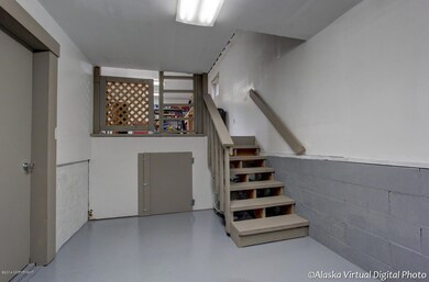 2nd garage bay with stairs going to shop