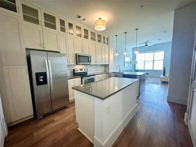 High ceilings and open concept kitchen with stainl