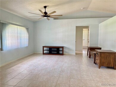 Large bright living room with tile floors