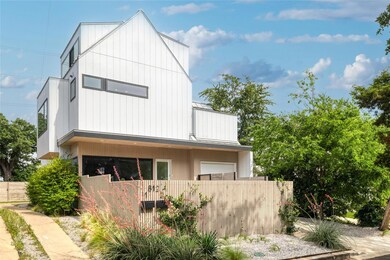 View of side of property with fence, metal roof, 