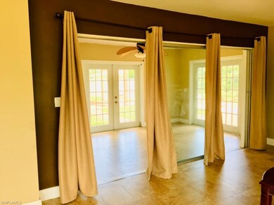 Living room, looking out into extra living space (