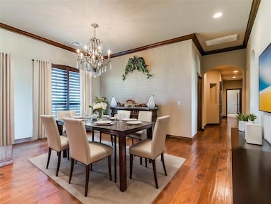 VIRTUALLY STAGED:Dining area featuring hardwood / 