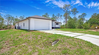 View of side of property with an attached garage,