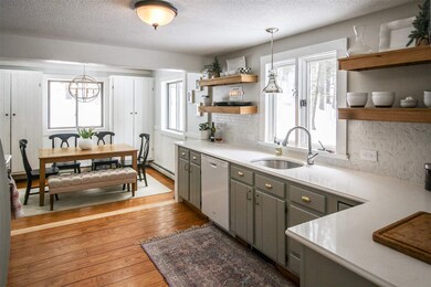 Kitchen opens to dining room and living room. New 
