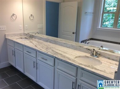 Representative of finished master bath with granit