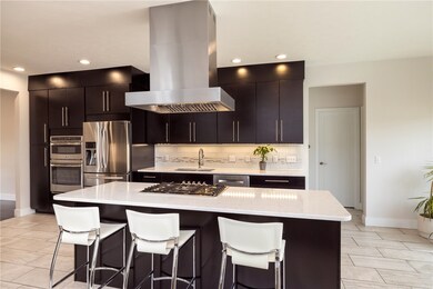 quartz countertops, glass tile backsplash