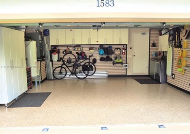 Wall Systems Garage cabinets, wall system. and immaculate epoxy floor.