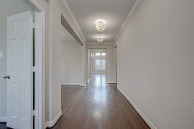 Open the door to a fabulously designed home! The warm wood floors flow seamless throughout the main living area.