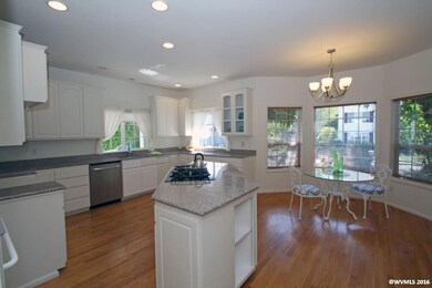 Wide open space with loads of storage and island.